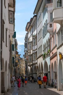 Bolzano, South Tyrol, Italy, Passers-by stroll through the Laubengasse in the old town centre,