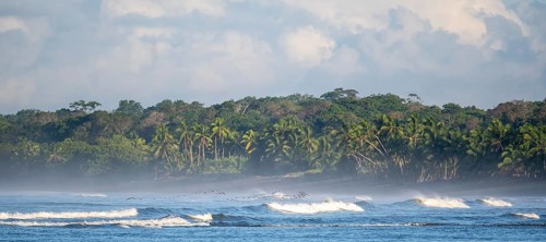 Coastal landscape, sea and sandy beach with rainforest, Corcovado National Park, Osa Peninsula,