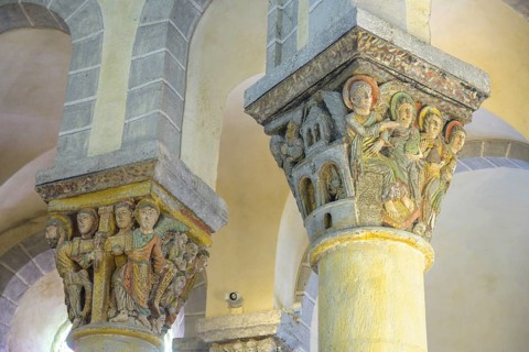Colourfully painted capitals in the Romanesque church of Saint-Nectaire, Département Puy-de-Dôme,