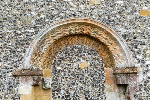 Chevron pattern of flint pebble blocked Norman doorway, church of Saint Mary, Kingsclere,