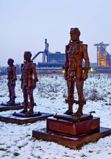 People made of iron, multi-part iron sculpture by Zbigniew Fraczkiewicz in front of the
