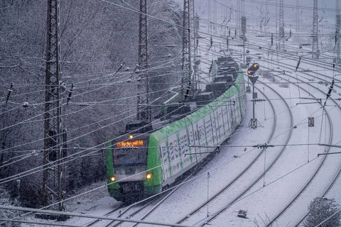 Winter weather, heavy snowfall, railway tracks in front of Essen main station, S-Bahn train, North