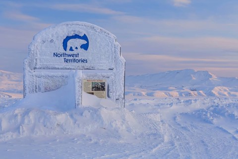 Sign, information board, icy, snowy, mountain landscape, Dempster Highway, Northwest Territories,