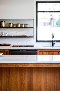 Wooden kitchen with top counter and other modern interior elements, AI generated