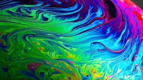Dynamic abstract background with swirling liquid patterns and colorful light refraction, creating a