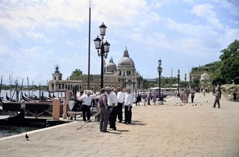 Gondoliers and gondolas, Riva degli Schiavoni, Basilica Santa Maria della Salute, Venice, Italy,