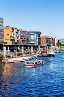 Building in the HafenCity Sandtorhafen harbour with boats in Hamburg, Germany, Europe