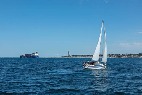Container ship, sailing boat, naval memorial, Laboe, Schleswig-Holstein, Germany, Europe