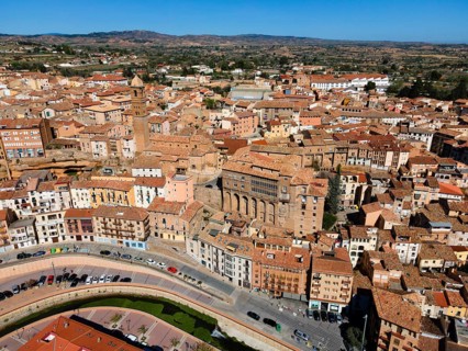Aerial view of a historic city with many narrow streets and tiled roofs, aerial view, church,