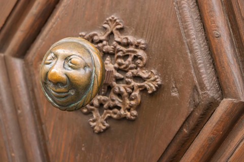 Stahlesches Schwesternhaus in the street Eisgrube in Bamberg. Doorknob with a cheerful face, known