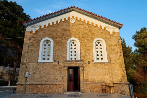 Historic church with striking stone façade and symmetrical windows, Koroni, Byzantine fortress,