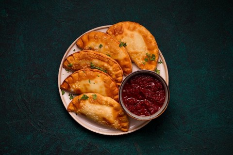 Fried mini pasties, with red sauce, top view, close-up, no people, selective focus