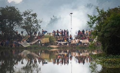 Villagers participate in a community fishing event on the occasion of the Bhogali Bihu festival at