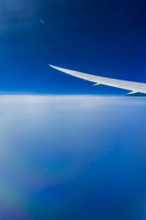 Blue sky, cloud structures over the Arabian Sea. View from the aircraft window during a flight from