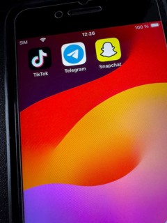 App symbols of chat programmes free instant messaging service from China TikTok on the left centre