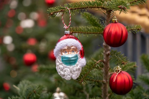 Symbolic image of Christmas in the Corona crisis, Father Christmas figure, Christmas tree