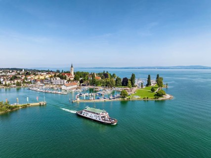 Harbour area, ferry port, yacht harbour, marina of Romanshorn with Seepark and the departing ferry