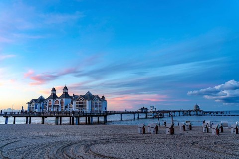 The pier of Sellin, evening mood, sunset, 394 metres long, with restaurant, jetty, beach chairs,