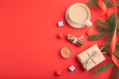 Christmas or New Year composition. Decorations, box, cinnamon, fir and spruce branches, cup of