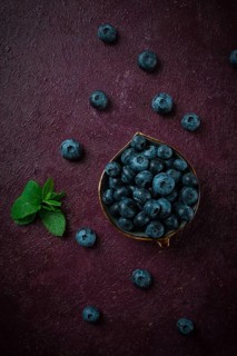 Fresh berries, Blueberries, on a maroon background, food concept, vertical, no people
