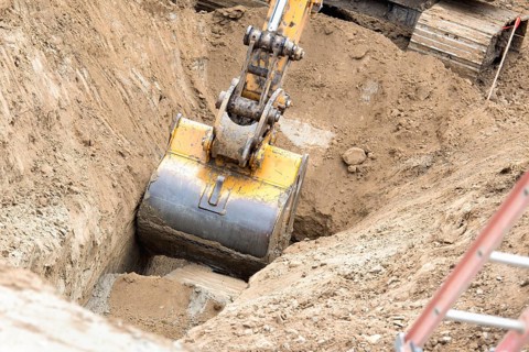 Working excavator tractor digging A trench