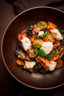Warm Salad with crispy eggplant and tomatoes, cottage cheese, spices, herbs, sesame seeds,