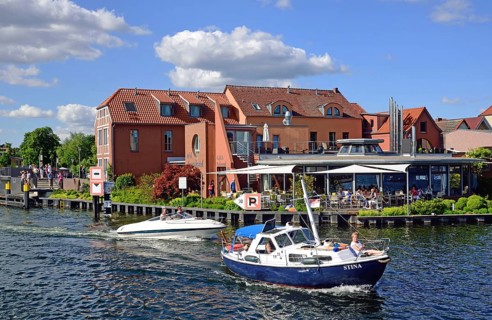 Europe, Germany, Mecklenburg-Western Pomerania, island town of Malchow, Lake Malchow, at the swing