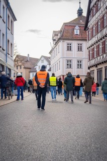 Steward with safety waistcoat on an empty street in a city, Against Right Demo, Nagold, Black