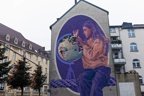 Mural, Girl with globe and compass, after a Gerhard Mercator portrait, mural by the artist duo