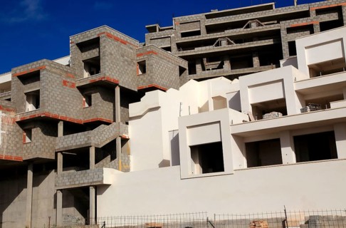 Concrete shells of uncompleted housing in the Castillo development, Caleta de Fuste, Fuerteventura,