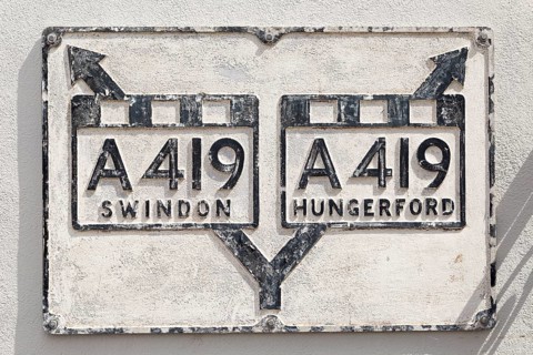 Old road junction A419 road sign for Swindon and Hungerford at Ramsbury, Wiltshire, England, UK
