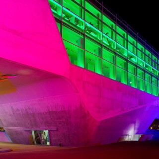 The colourfully illuminated phæno building, an experimental landscape and a science centre in the