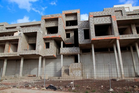 Concrete shells of uncompleted housing in the Castillo development, Caleta de Fuste, Fuerteventura,