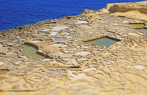 Historic ancient salt pans on coast near Marsalforn, island of Gozo, Malta, Europe