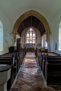 Interior view to altar and east window church of All Saints, Rede, Suffolk, England, UK