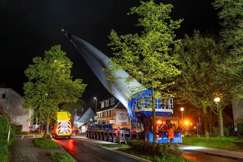 Transport of a 68 metre long, 22 tonne blade of a wind turbine, here in Breckerfeld-Waldbauer, with