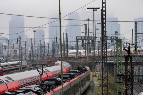 Railway tracks with regional and long-distance trains, ICE, after freezing rain, in front of
