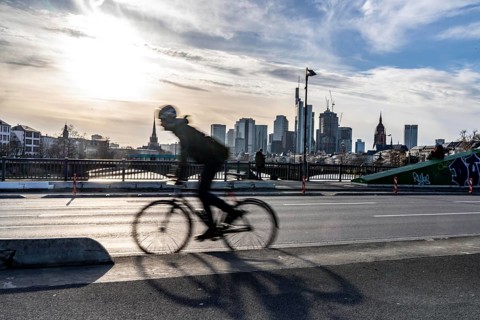 Skyline of Frankfurt am Main, skyscrapers, cyclists on the Flößerbrücke, Hesse, Germany, Europe