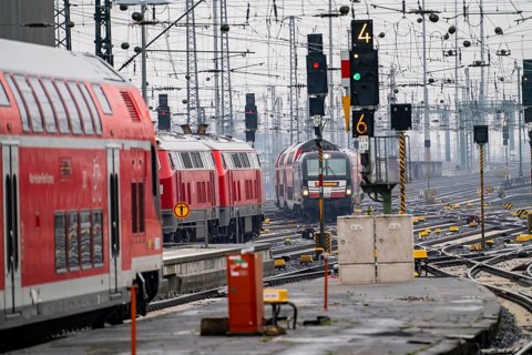 Railway tracks with regional trains, after freezing rain, in front of Frankfurt main station,