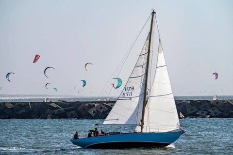 Sailing boat leaves the harbour of Scheveningen, Netherlands