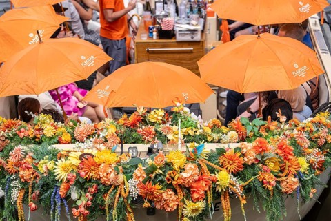 Canal cruise, with flagship organiser, canal boats decorated with flowers, passengers with