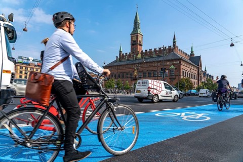 Cyclists on cycle paths, Radhuspladsen, City Hall Square, in the city centre of Copenhagen,