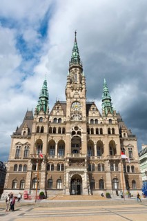 Gothic town hall with flags and clouds in the sky, an urban experience, Town hall, Liberec,