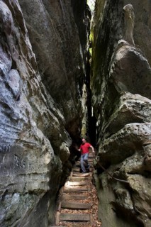 Trail with stairs leading through narrow gorge in the sandstone rock formation Perekop in Berdorf,