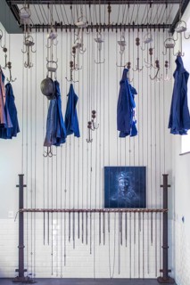 Changing room with pulleys and chains to hoist coal miners clothes at Le Bois du Cazier, coal