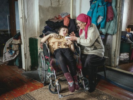 Lena, 70 years old, cares for her severely disabled granddaughter Lena, 18 years old. The family