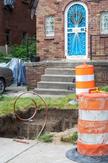 Detroit, Michigan, Workers replace old lead water service lines with copper pipes. Lead is harmful