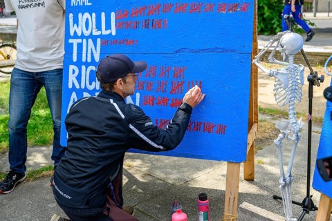 Richard Cluse marks the 60th day of his hunger strike on a large board. On the right, a skeleton