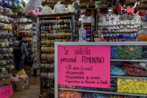 Oaxaca, Mexico, A help wanted sign in a store specifies that the store wants a woman, 20 years or