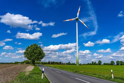 Wind turbine, wind energy plant from the manufacturer Enercon, blue sky with many white clouds,